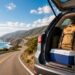Road trip checklist with packed car essentials on a scenic highway.