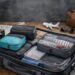 Packing cubes organizing clothes inside a suitcase for efficient travel.