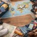 Ultimate travel packing list essentials with suitcase and accessories.