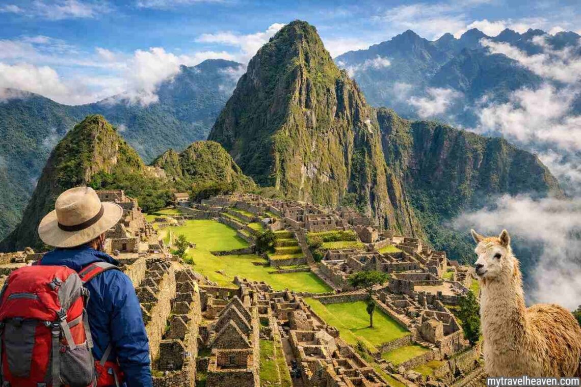 Traveler overlooking Machu Picchu ruins with mountain backdrop.