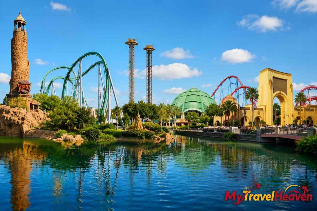 Explore the four theme parks with thrilling roller coasters, scenic waterfront views, and the MyTravelHeaven logo in the bottom-right corner.